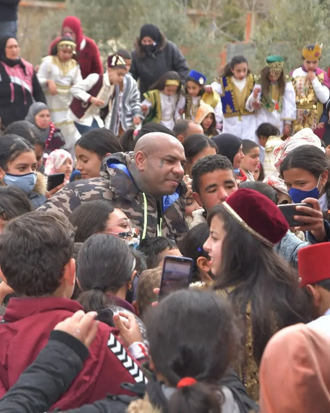 Children gathered in the street in Ksar Said