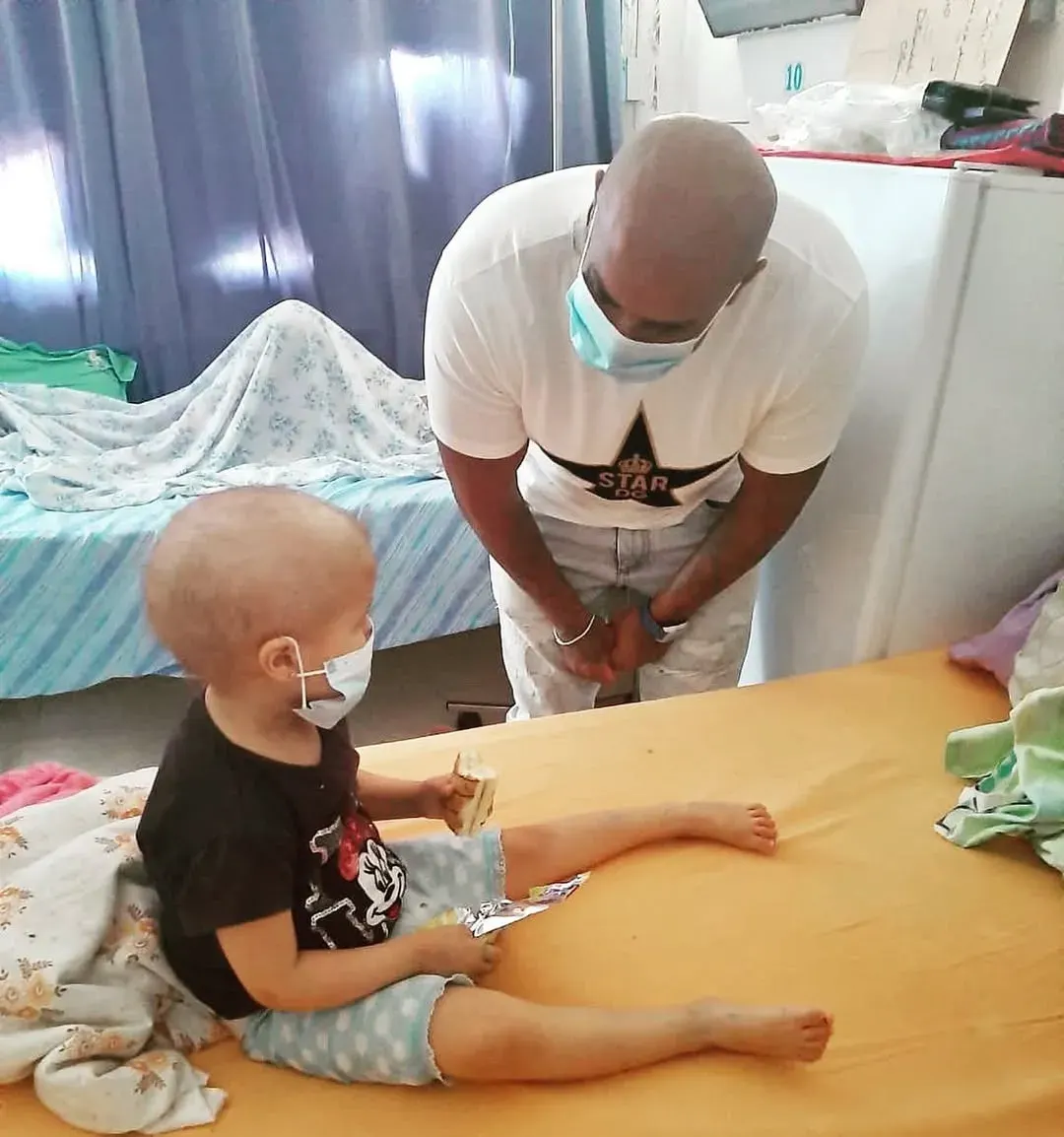 A child in hospital receiving a visit