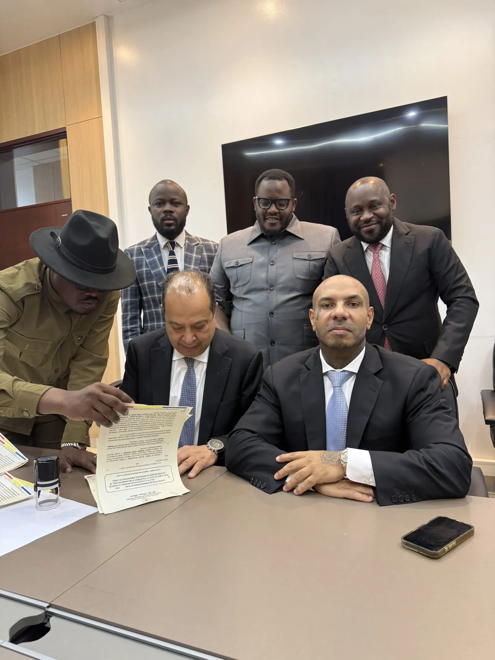 Karim Gharbi signing an agreement