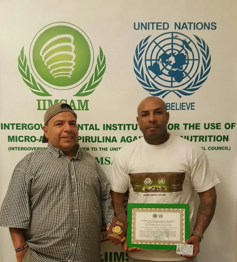 K2Rhym receiving his IIMSAM Global Goodwill Ambassador certificate